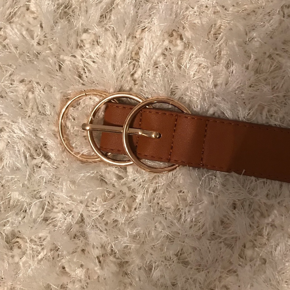 brown belt with gold buckle